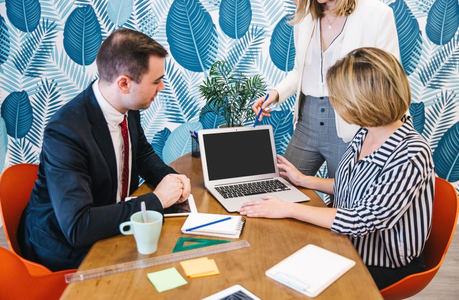 Financial analysis workshop participants collaborating on market data interpretation exercises